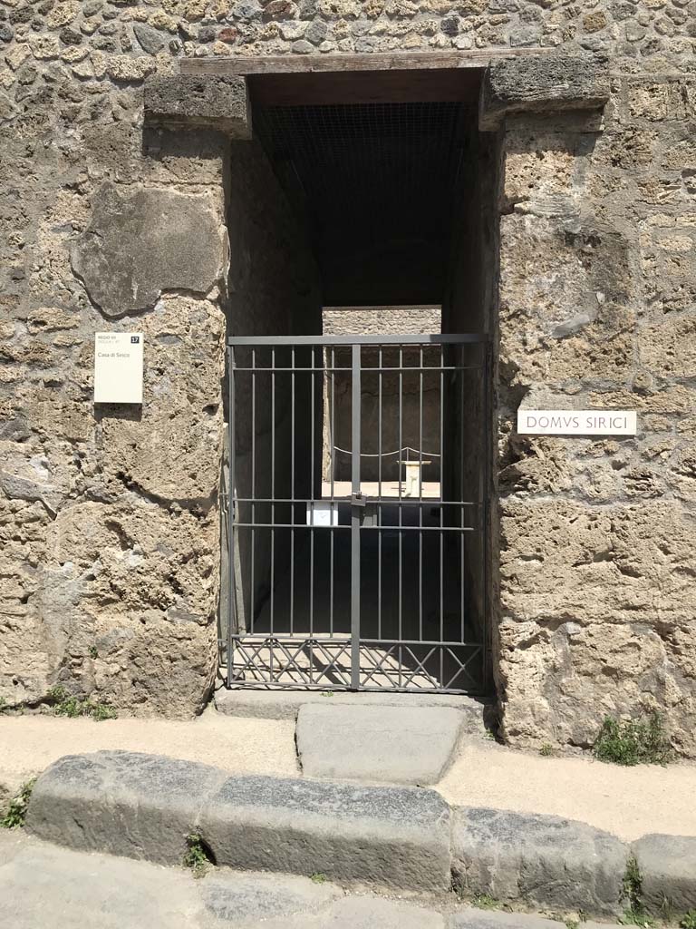VII.1.47 Pompeii. April 2019. Looking east to entrance doorway on Vicolo del Lupanare.  
Photo courtesy of Rick Bauer.

