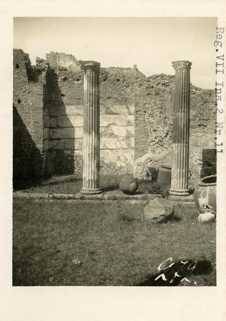 VII.2.11 Pompeii. Old undated photograph. Looking towards south-east corner of peristyle, and stairs. 