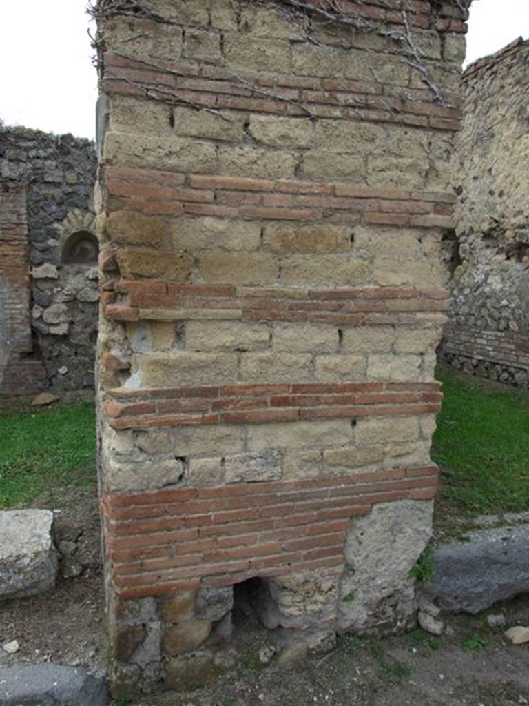 VII.2.12 Pompeii. December 2007. Pillar between VII.2.12 and VII.2.13 on Via Stabiana. With drainage outlet?