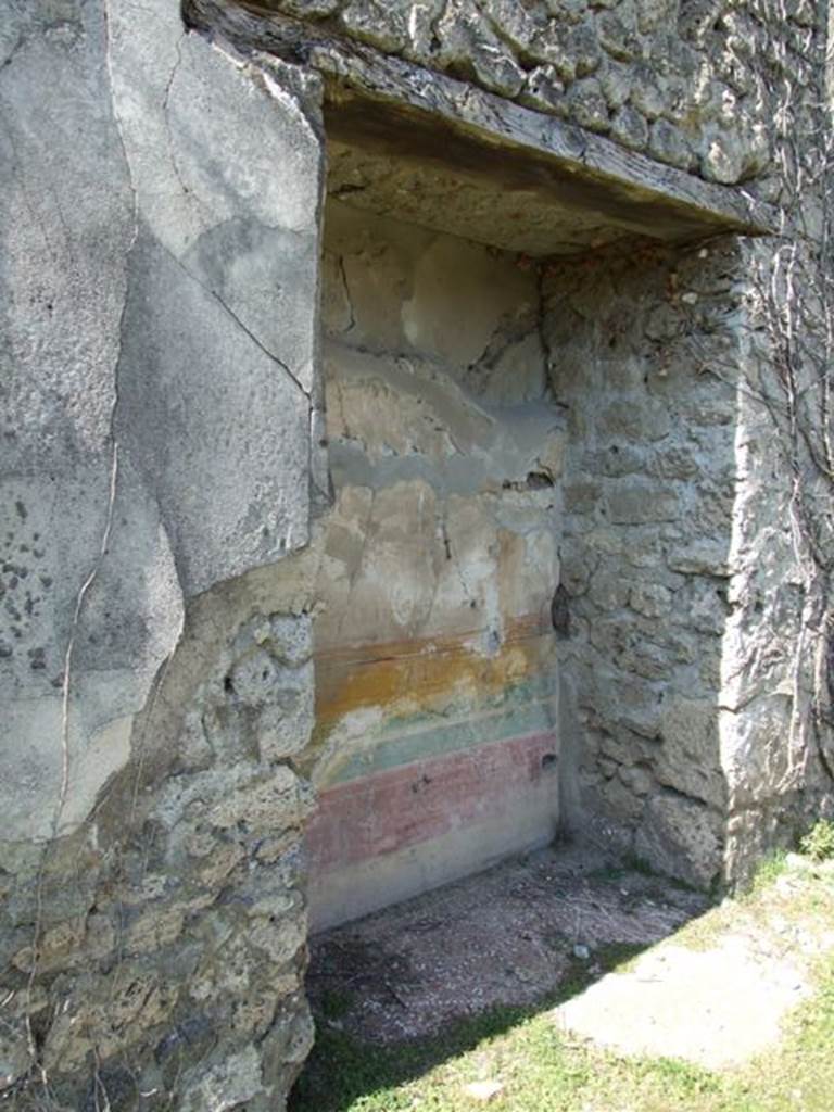 VII.2.16 Pompeii. March 2009. Lararium niche in west wall of portico, according to Fiorelli, originally with doors.