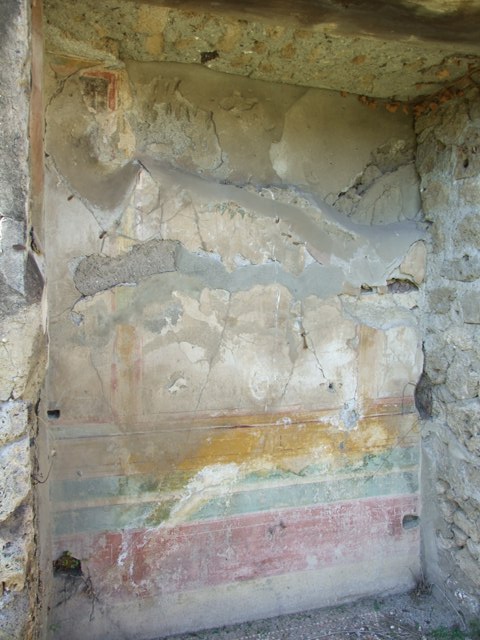 VII.2.16 Pompeii.  March 2009. Upper south west corner of Lararium Niche in west wall of Portico.