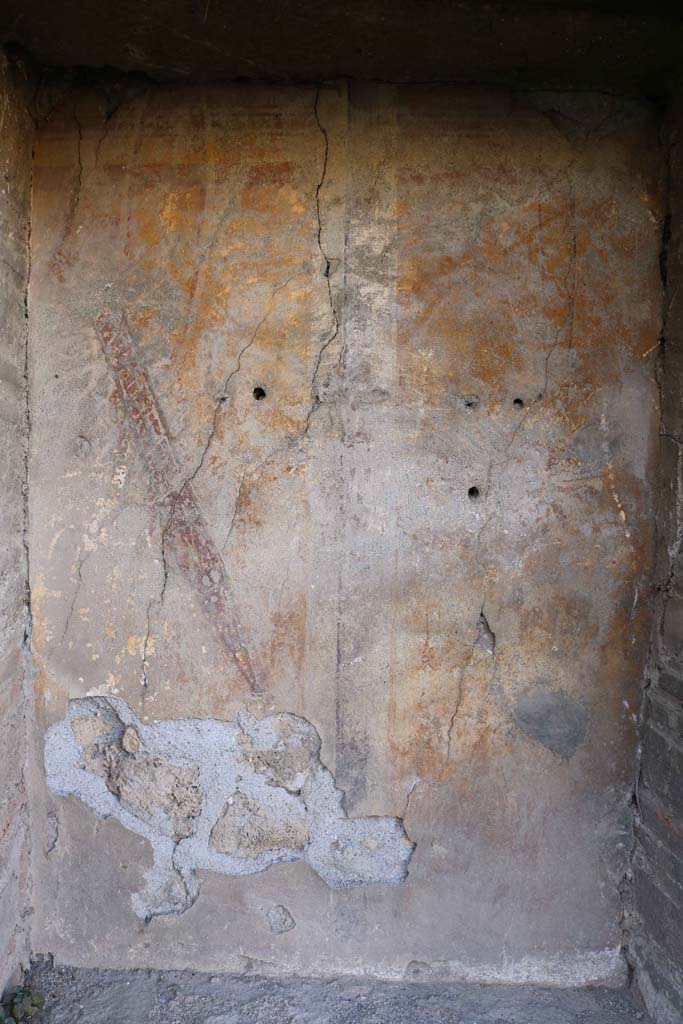 VII.2.18, Pompeii. December 2018. 
Looking towards painting on rear wall of lararium, showing a sword in a red sheath. 
Photo courtesy of Aude Durand.
