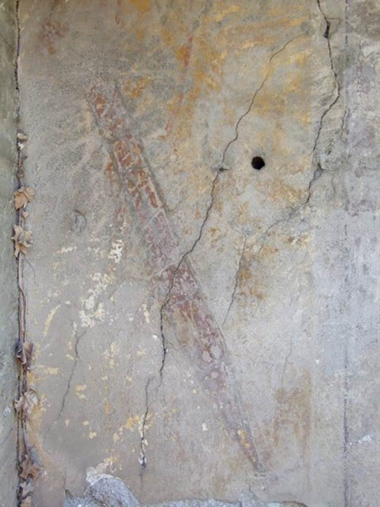 VII.2.18 Pompeii. March 2009. Painting on rear wall of lararium, showing a sword in a red sheath.