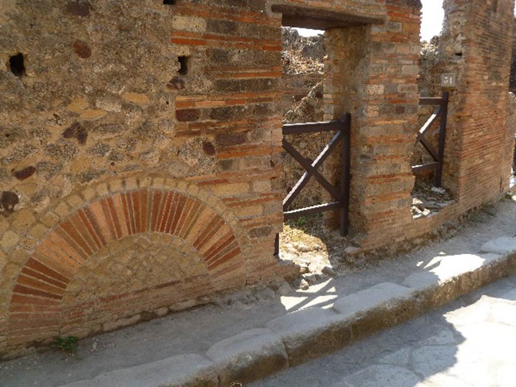 VII.2.30 Pompeii. July 2010. Entrance doorway, showing wall on north-east side. Photo courtesy of Michael Binns.