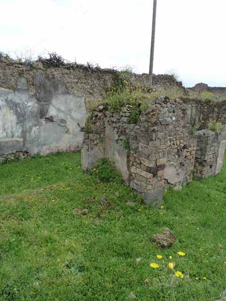 VII.2.35 Pompeii. May 2010. South-east corner of garden and doorway to triclinium.