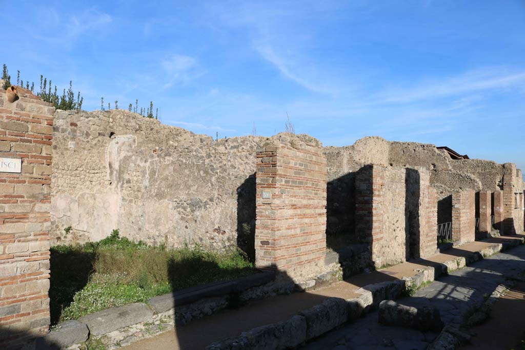 VII.2.39, Pompeii, on left. December 2018. Looking east along north side of Via degli Augustali. Photo courtesy of Aude Durand.