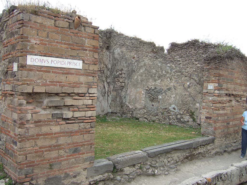 VII.2.39 Pompeii. May 2006. Entrance to shop on Via degli Augustali.