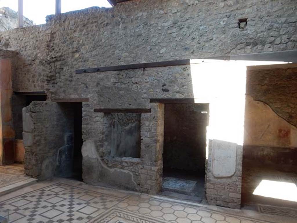 VII.2.45 Pompeii, May 2018. 
Looking east across atrium towards doorway to triclinium, on left, window and doorway to cubiculum, in centre, and doorway to triclinium in south-east corner, on right. Photo courtesy of Buzz Ferebee.

