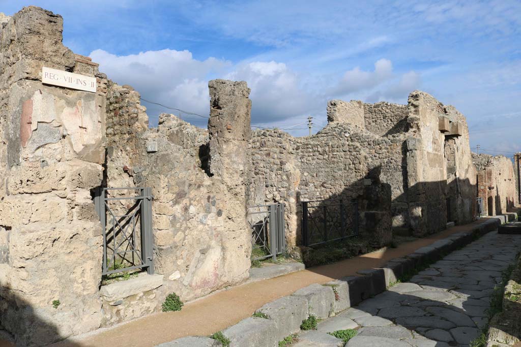 VII.2.47, Pompeii, on left. December 2018. Looking east along north side of Via degli Augustali. Photo courtesy of Aude Durand.