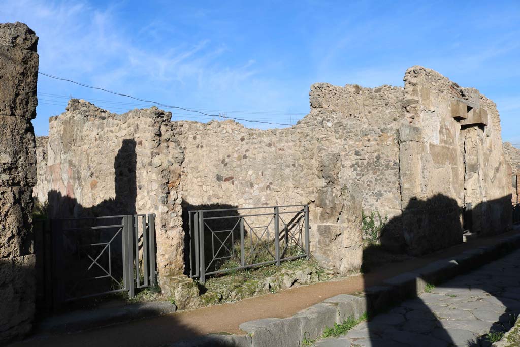 VII.2.48, Pompeii, on left. December 2018. Looking east along north side of Via degli Augustali. Photo courtesy of Aude Durand.
