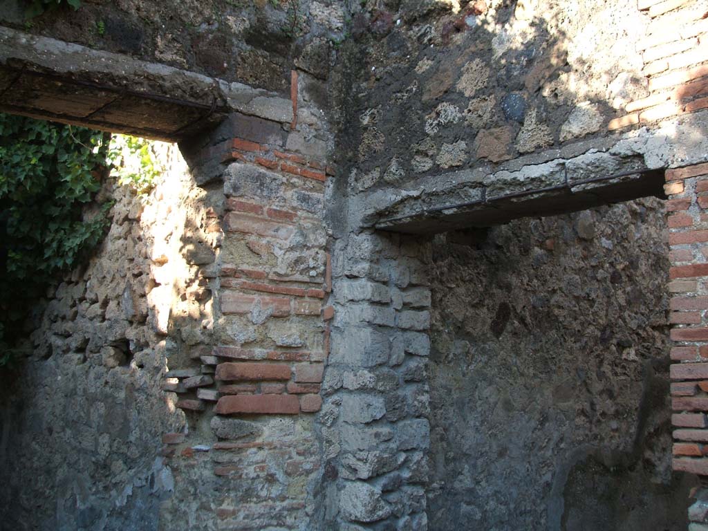 VII.2.51 Pompeii. December 2005. South-west corner of the atrium with remains of a hearth.