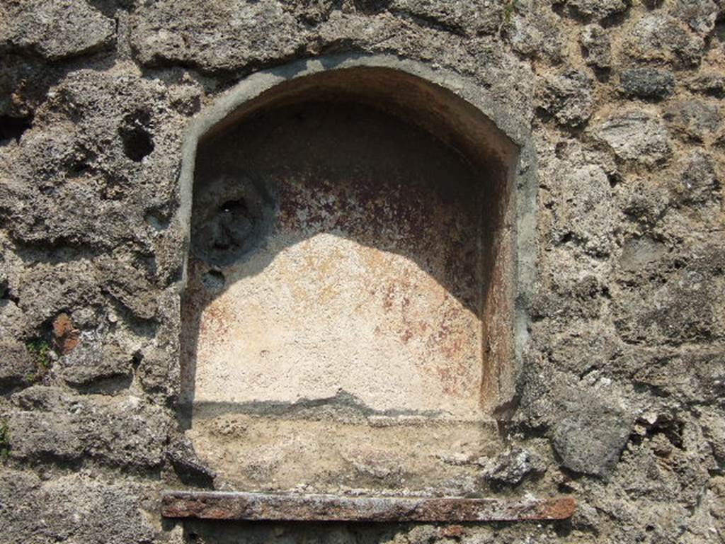VII.3.10 Pompeii. May 2006. Niche in east wall. According to Boyce, the inside walls of this arched niche were coated in red stucco. Fiorelli called it la nicchia dei Penati.  See Boyce G. K., 1937. Corpus of the Lararia of Pompeii. Rome: MAAR 14. (p. 64, no.262)   See Pappalardo, U., 2001. La Descrizione di Pompei per Giuseppe Fiorelli (1875). Napoli: Massa Editore. (p. 86)

