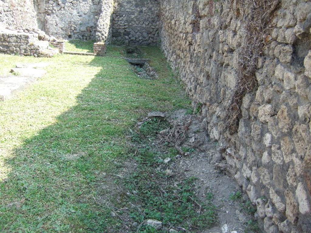 VII.3.10 Pompeii. May 2006. Looking south across shop to latrine, at rear on right. 