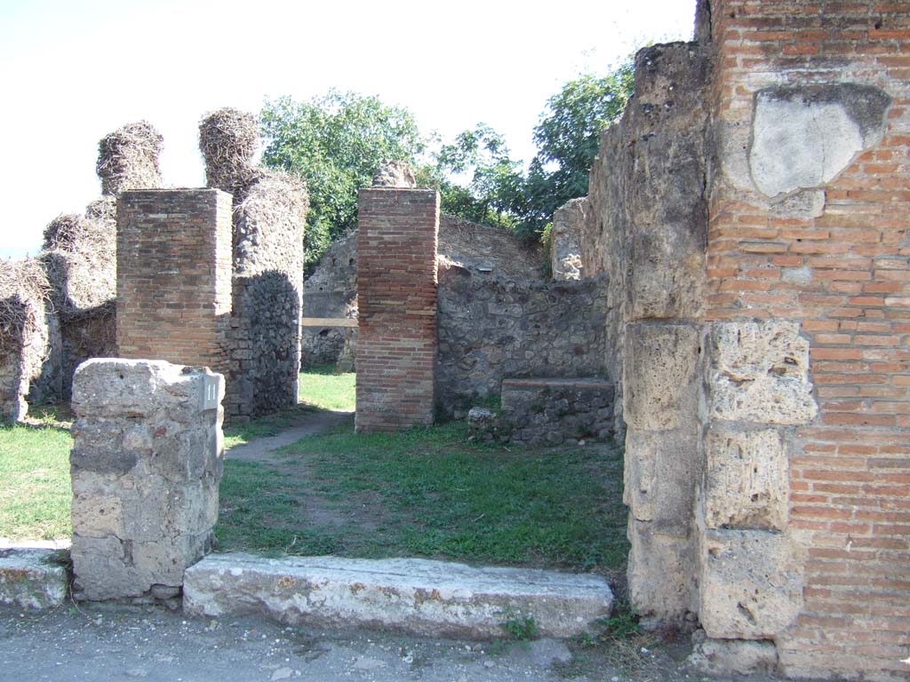 VII.3.12, on left and VII.3.11, on right, Pompeii. December 2018. Looking south to both entrances. Photo courtesy of Aude Durand.