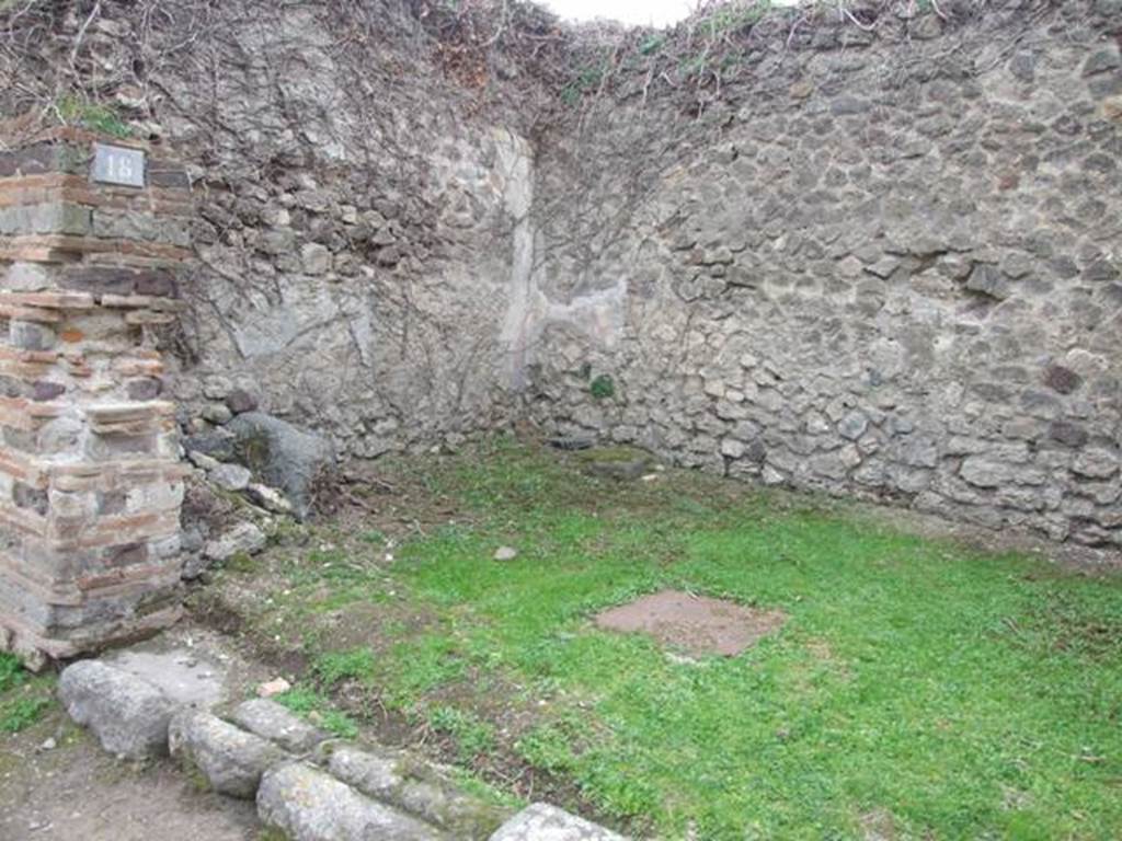 VII.3.18 Pompeii.  Shop.  December 2007.  South wall with latrine near door, remains of staircase and cistern mouth at rear.