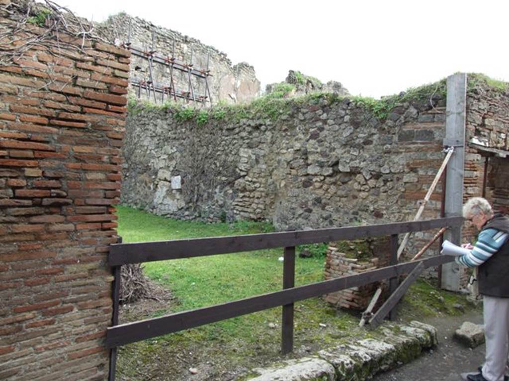 VII.3.37 Pompeii. March 2009. Looking south-east to two entrances, VII.3.37 and VII.3.36 on right (separate stairs to upper floor). 


