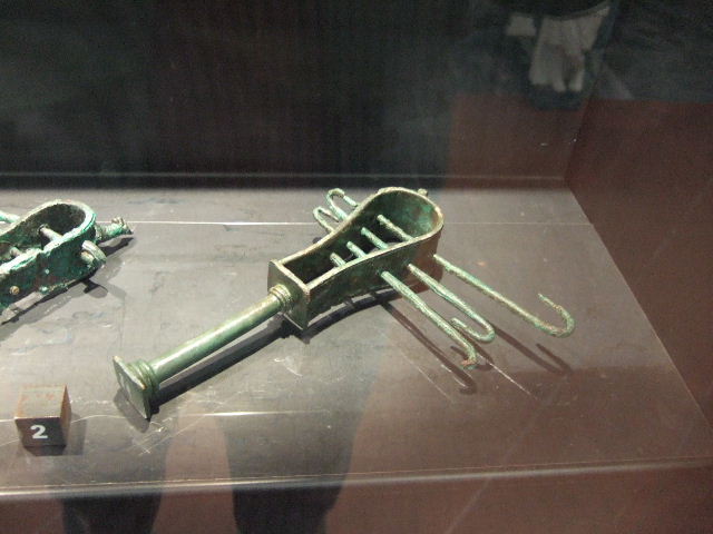 Bronze Sistrum found in VII.4.13.  Now in Naples Archaeological Museum.