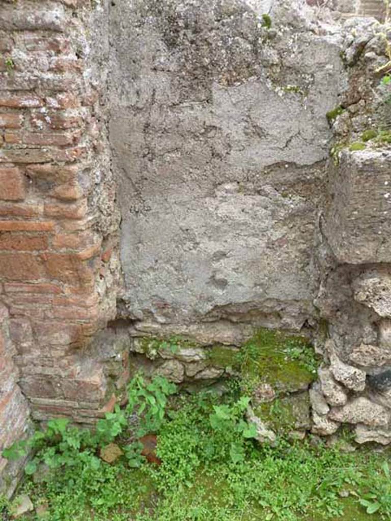 VII.4.41 Pompeii. May 2010. Latrine on south side of entrance. The steps to the upper floor would have been above this latrine.