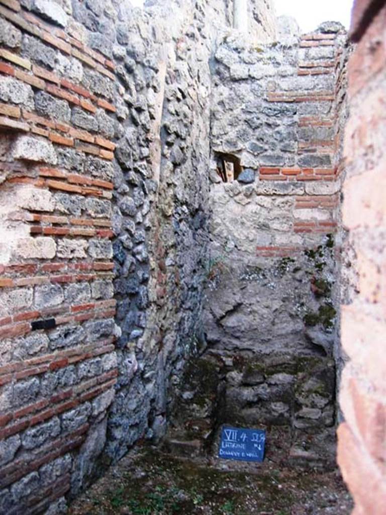 VII.4.54 Pompeii. July 2008. Looking south to latrine, with downpipe in east wall. Photo courtesy of Barry Hobson