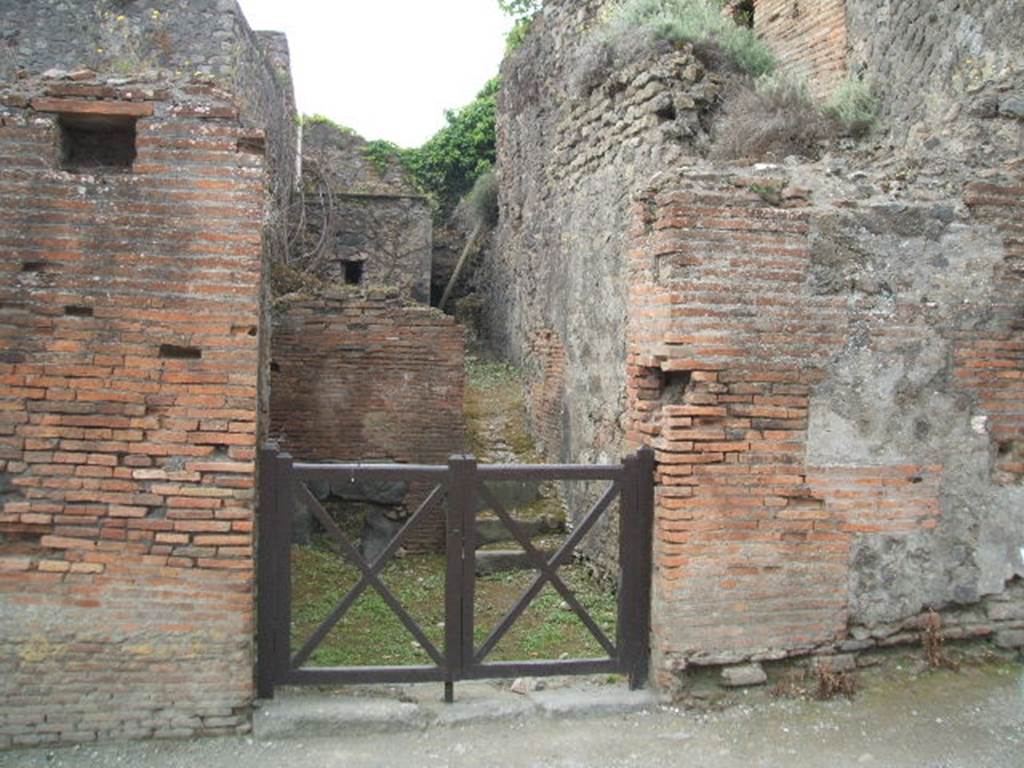 VII.5.7 Pompeii.  Entrance to Forum Baths.  May 2005.  Entrance.
Found in February 1824 on the second pilaster of bricks…..(on the right), painted in red were –
M(arcum)  [V]esonium
Marcellum  [     [CIL IV 273]
M(arcum)  Cerrinium  [V]a[tia]m
aed(ilem)  saccari  rog(ant)       [CIL IV 274]
A(uli)  Suetti  Cer[ti  familia  gladiatorial  pugnabit(?)     CIL IV 1191 
Also found between VII.5.7 and 8 in July 1824 was –
M(arcum)  C(errinium)  V(atiam)  v(irum)  b(onum)  aed(ilem)  o(ro)  v(os)  f(aciatis)  Colepius
rog(at)    [CIL IV 246]
See Pagano, M. and Prisciandaro, R., 2006. Studio sulle provenienze degli oggetti rinvenuti negli scavi borbonici del regno di Napoli.  Naples : Nicola Longobardi.  (p.128 and p.130)
According to Della Corte, the noble Colepius [CIL IV 246 above, and Note 1 on p.117] was not well-known outside of Pompeii. He thought that probably the family house was on the Via degli Augustali, because of the other similar recommendations found there.
See Della Corte, M., 1965.  Case ed Abitanti di Pompei. Napoli: Fausto Fiorentino. (p.116-7)
