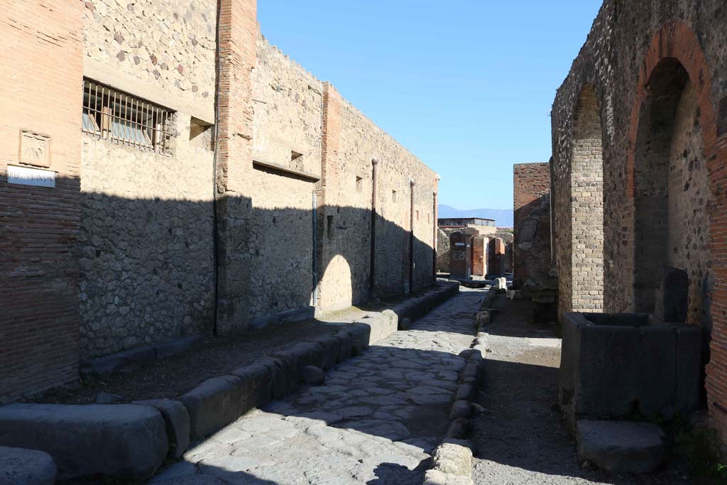 VII.5.14 Pompeii, on left. December 2018. 
Looking east on Vicolo dei Soprastanti between VII,5, on left and VII.8, on right. Photo courtesy of Aude Durand.
