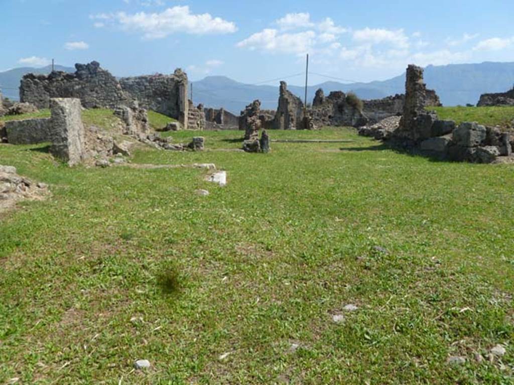 VII.6.7 Pompeii. May 2011. Looking south towards site of remains of rooms on the west side of the tablinum and atrium.
This area could be approximately the site of the right ala.
According to Boyce, in the right ala of the atrium stood a large masonry podium, which Fiorelli thought may have been the base of a Lararium.
See Boyce G. K., 1937. Corpus of the Lararia of Pompeii. Rome: MAAR 14.  (p.67. no.288).

