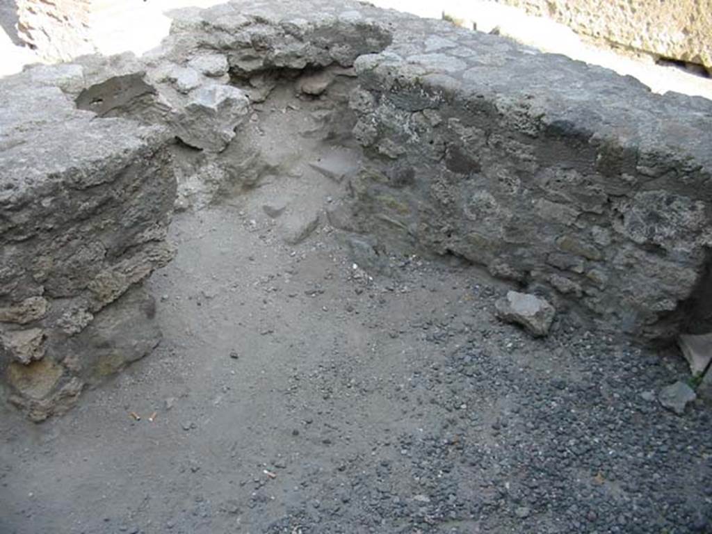 VII.7.9 Pompeii. May 2003. Looking towards rear of two-sided counter, where there would have been two dolia embedded into the counter.  Photo courtesy of Nicolas Monteix.
