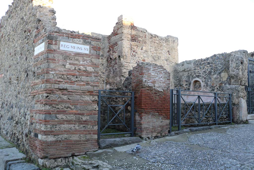 VII.7.11 Pompeii on right with VII.7.12 on left. December 2018. 
Looking north-east towards entrance doorways from Via Marina. Photo courtesy of Aude Durand.


