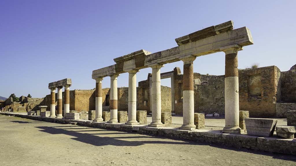 VII.8 Pompeii Forum. June 2019. Looking east across Forum towards Eumachia’s Building. Photo courtesy of Buzz Ferebee.

