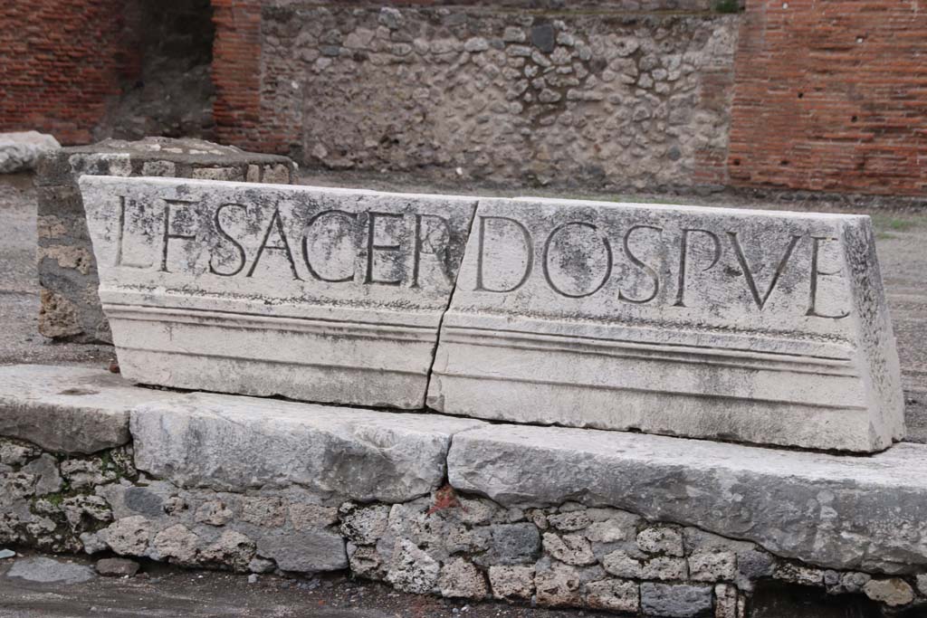 VII.8 Pompeii Forum. October 2020. Part of inscription on Portico of Eumachia’s Building, on east side of Forum. Photo courtesy of Klaus Heese.