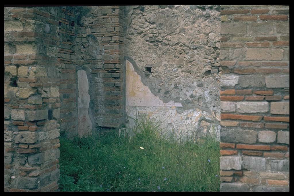 VII.9.1 Pompeii. Looking through doorway towards north-west corner at west end of north corridor 12.
Photographed 1970-79 by Günther Einhorn, picture courtesy of his son Ralf Einhorn.

