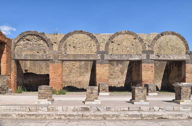 VII.9.9 Pompeii, on right. April 2018. Looking east towards exterior facades of shops at VII.9.12/11/10 and 9. Photo courtesy of Ian Lycett-King. Use is subject to Creative Commons Attribution-NonCommercial License v.4 International.
