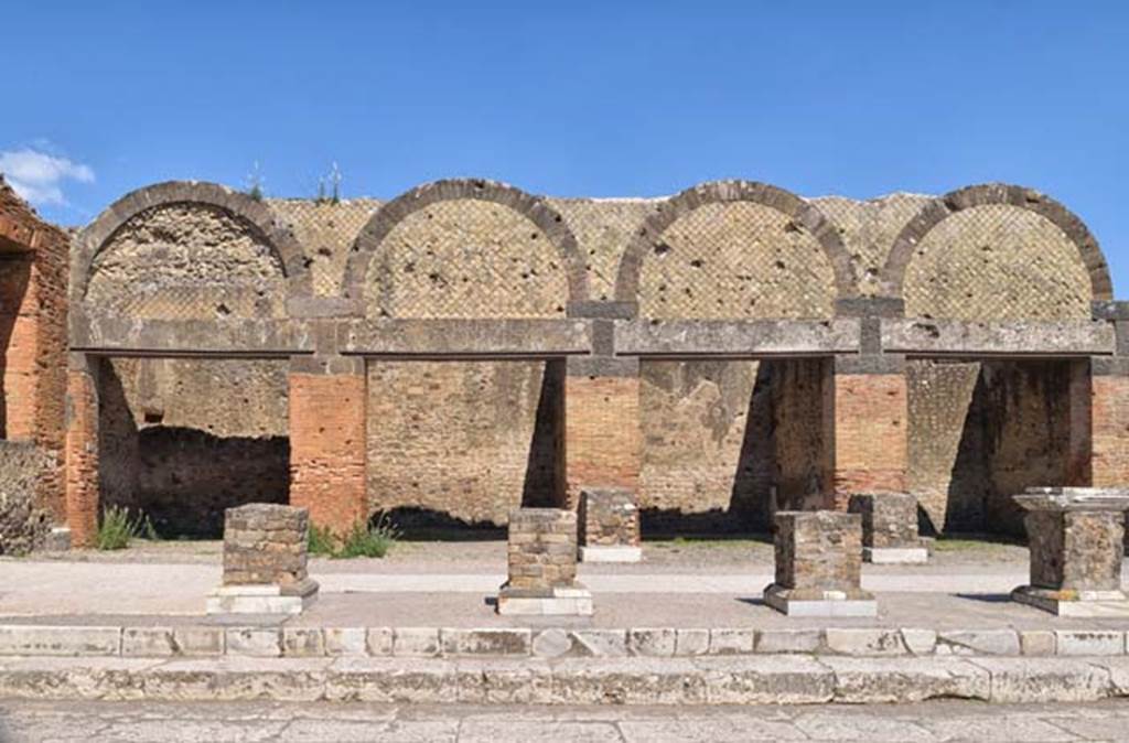 VII.9.12 Pompeii, on left. April 2018. Looking east towards exterior facades of shops at VII.9.12/11/10 and 9. Photo courtesy of Ian Lycett-King.  Use is subject to Creative Commons Attribution-NonCommercial License v.4 International.


