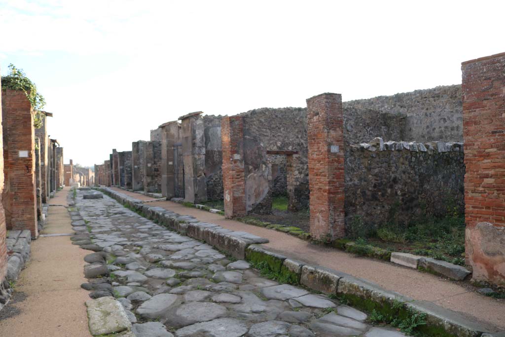 Via degli Augustali, Pompeii, south side. December 2018. Looking east from VII.9.16 on right. Photo courtesy of Aude Durand.