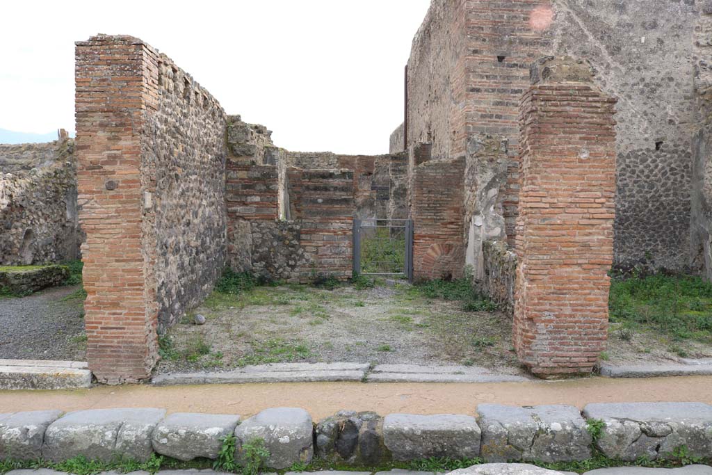 Via degli Augustali Pompeii, south side. December 2018. 
Looking towards entrance doorways, with VII.9.28, on left, VII.9.27 in centre, and VII.9.26, on right. Photo courtesy of Aude Durand.

