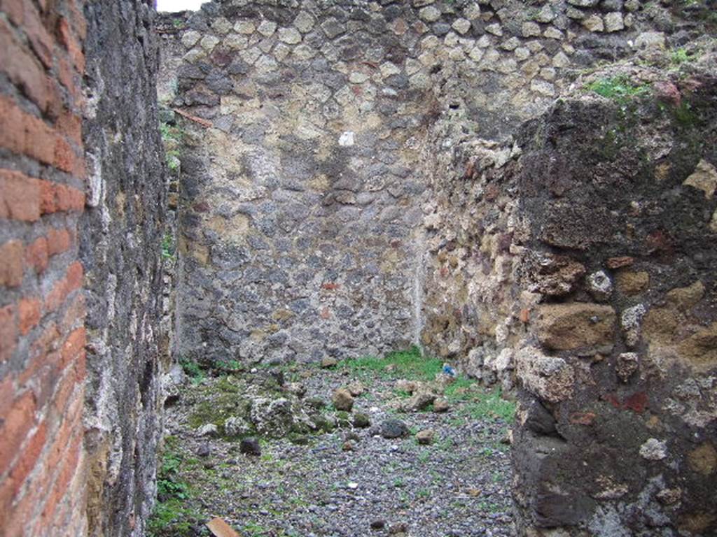VII.9.32 Pompeii. December 2005. Site of steps to upper floor, at front.
At rear is a room on the north side of the atrium of VII.9.33, looking west.
