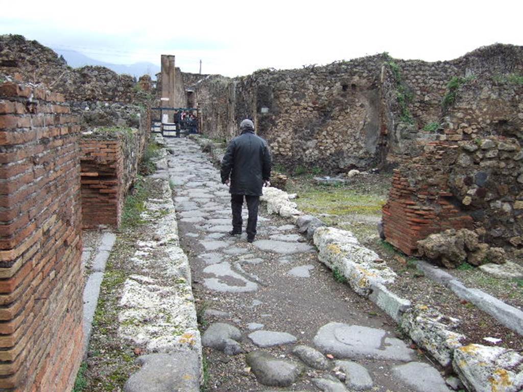 VII.9.36 Pompeii. December 2005. Vico di Eumachia looking north.   VII.12
