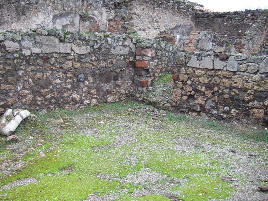 VII.9.36 Pompeii. December 2005. North-west corner and doorway leading to latrine, under stairs to upper floor at VII.9.35 
