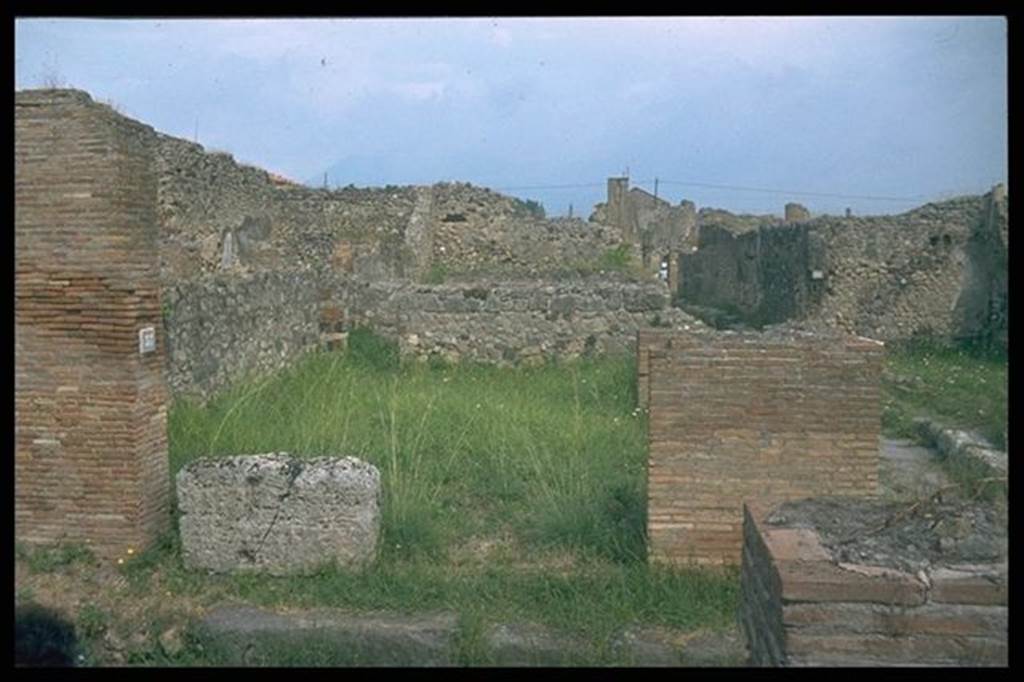 VI.9.37 Pompeii.  Entrance with podium, on Vico del Balcone Pensile. 
Looking north into VII.9.36.  Photographed 1970-79 by Günther Einhorn, picture courtesy of his son Ralf Einhorn.

