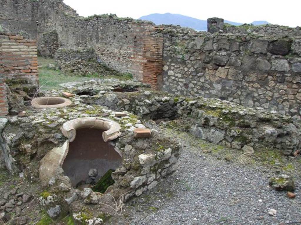 VII.9.54 Pompeii.  March 2009.  Counter with remains of dolia.