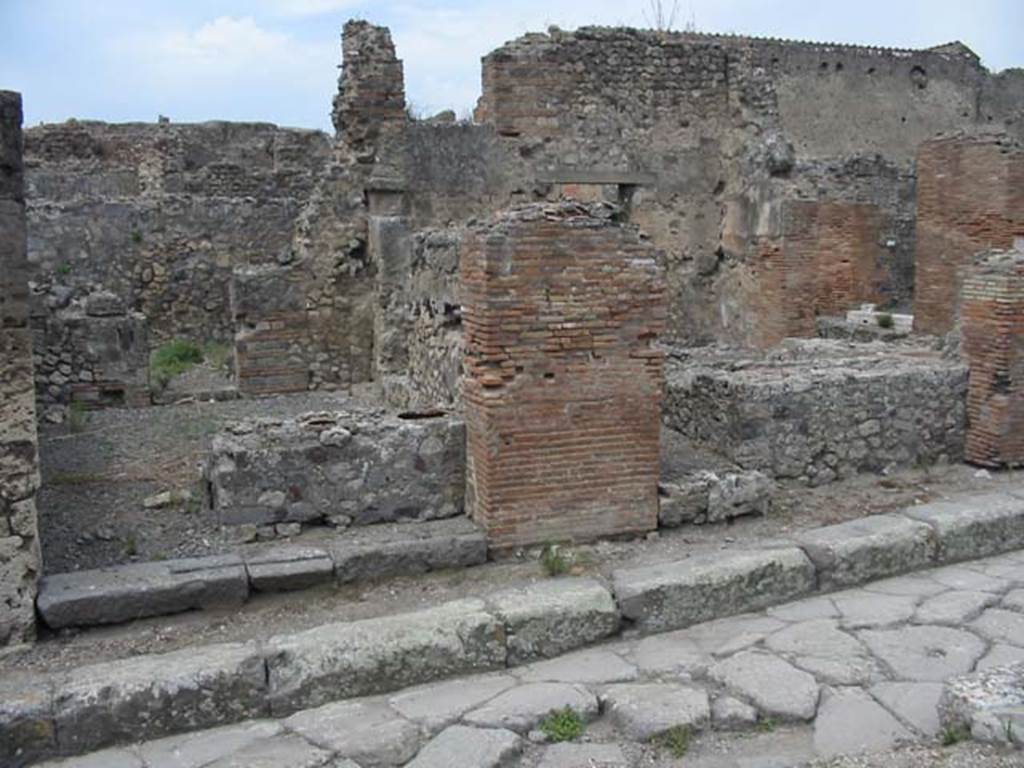 VII.9.56 Pompeii, on left. May 2003. Looking west towards entrance doorways on Vicolo di Eumachia. Photo courtesy of Nicolas Monteix.