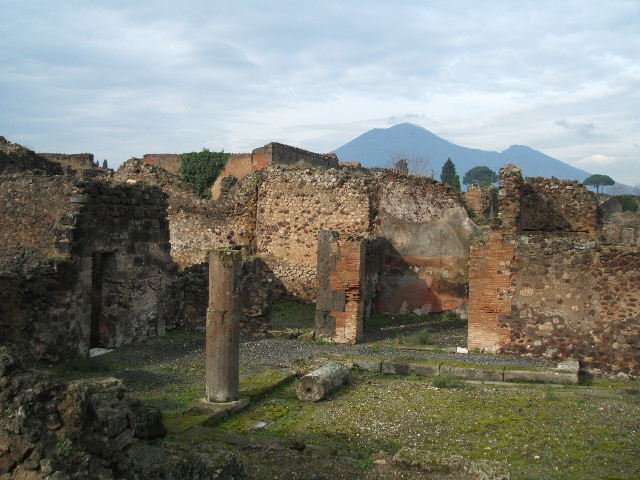 VII.9.60 Pompeii. December 2004. Looking north towards three doorways around the peristyle, from the top of Eumachia’s Building
