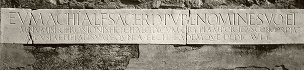 VII.9.67 Pompeii. March 2009. Copy of marble plaque with inscription, re-instated above the doorway.