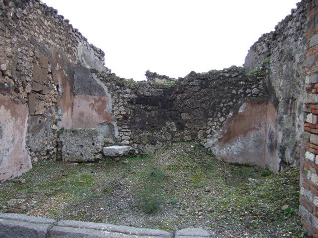 VII.10.4 Pompeii. December 2005. Looking east across shop. On the left at the rear can be seen a block of travertine which was the base step for the wooden steps that would have led to the upper floor. The line of the stairs could be traced in the plaster on the north wall.




