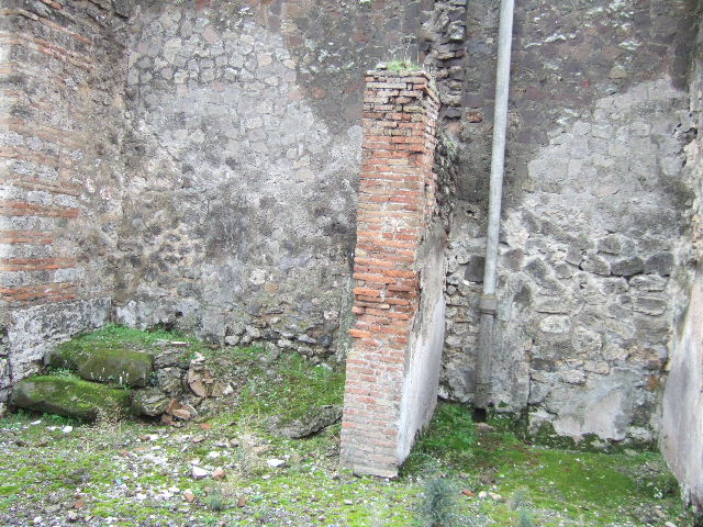 VII.10.5 Pompeii. December 2005.Two small rooms on south side of peristyle, one with steps to upper floor, the other a small storeroom.