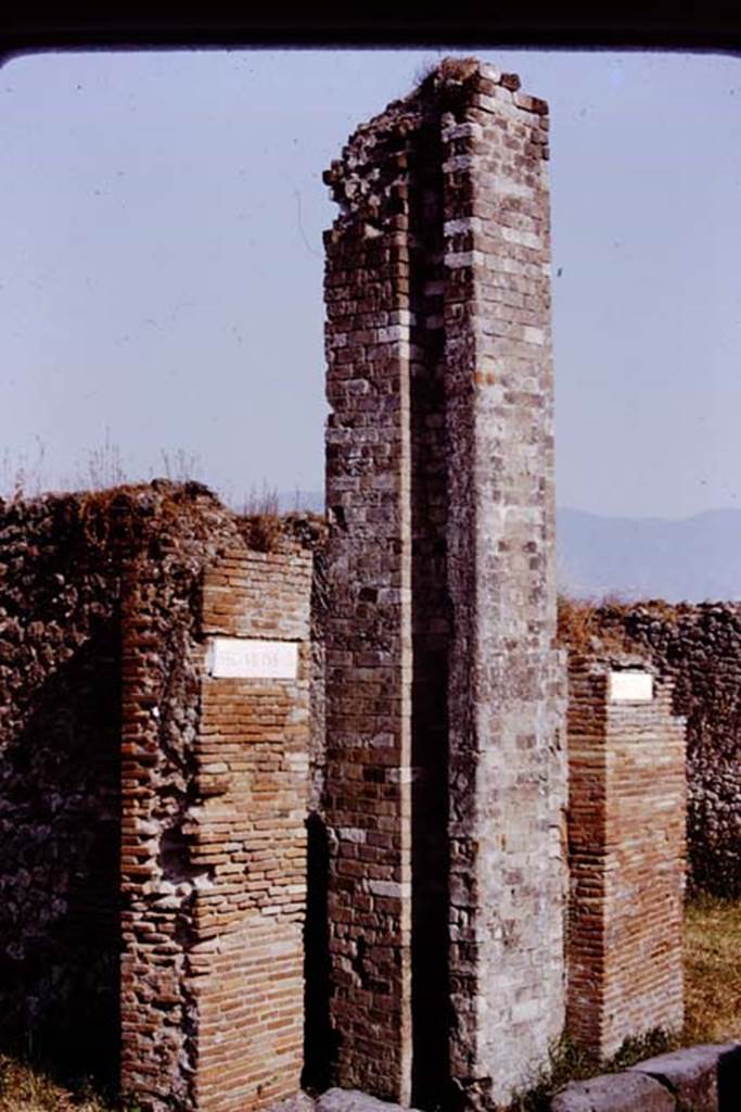 VII.10.7 Pompeii. 1980. Looking south-east towards water castle/tower on east side of Vicolo di Eumachia. Photo by Stanley A. Jashemski.   
Source: The Wilhelmina and Stanley A. Jashemski archive in the University of Maryland Library, Special Collections (See collection page) and made available under the Creative Commons Attribution-Non Commercial License v.4. See Licence and use details. J80f0219

