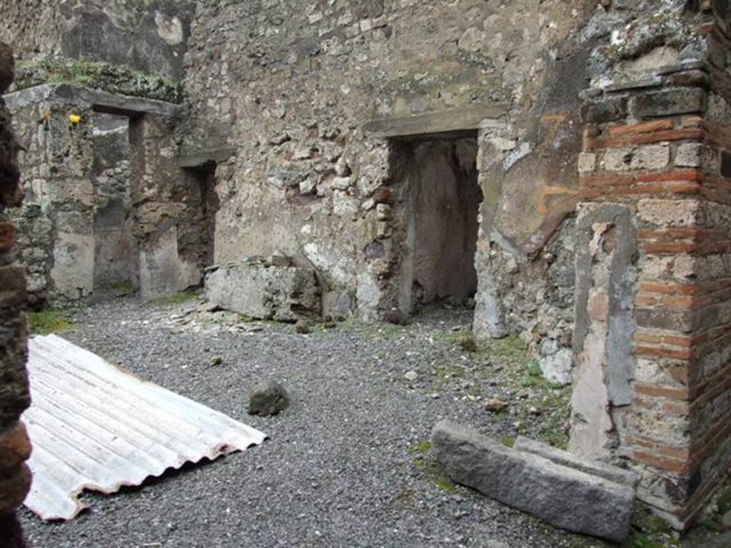 VII.10.9 Pompeii. March 2009. Looking south-west across small atrium to doorways to two cubicula and corridor, linking to VII.10.12.
