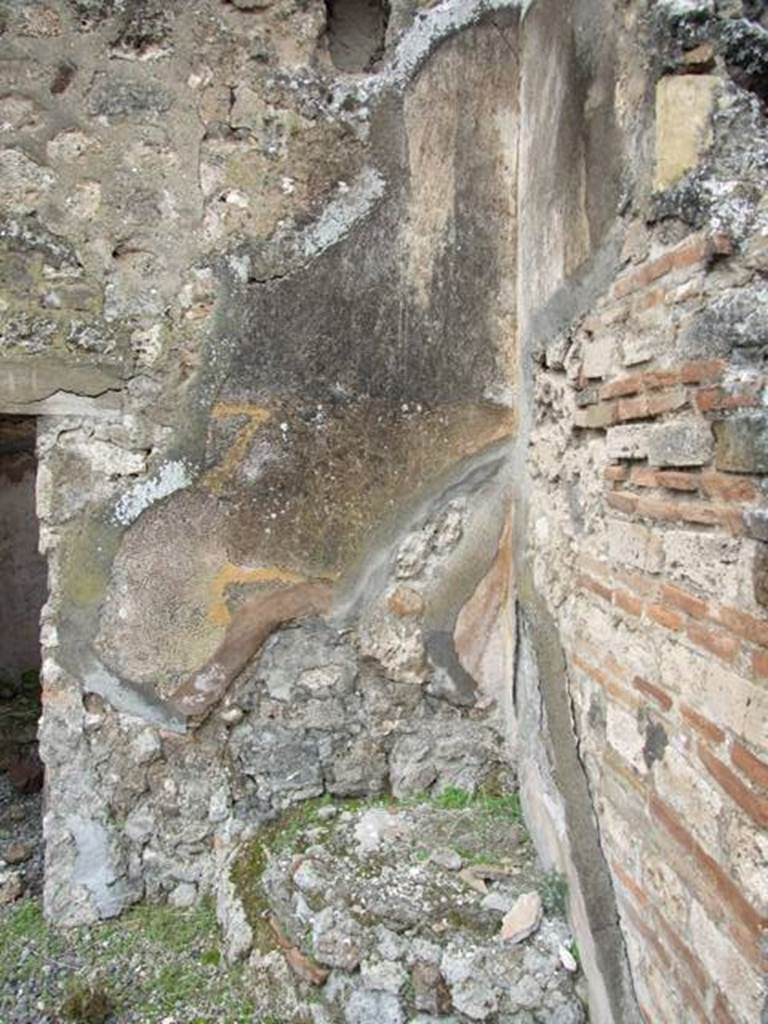 VII.10.9 Pompeii.  March 2009. Remains of plaster in north west corner of atrium.
