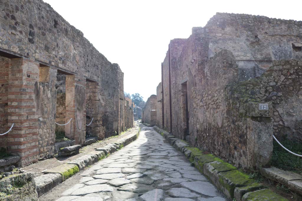 VII.10.12, Pompeii, on right. December 2018. 
Looking south on Vicolo della Maschera between VII,11, on left, and VII.10.12, on right. Photo courtesy of Aude Durand.

