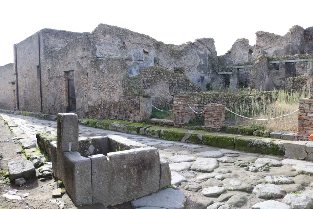 Looking south-west along Vicolo della Maschera. December 2018. 
From left to right are the entrances to VII.10.13, VII.10.12, VII.10.11 and VII.10.10.  Photo courtesy of Aude Durand.

